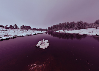 Image showing Amazing Cinematic Aerial View On Freezing River. Aerial View Flight Above Frozen Creek Scenic View Of Nature