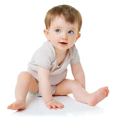 Image showing Cute, youth and explore with baby on floor of studio for curious, child development and learning. Face, smile and young with infant crawling in white background for toddler, innocence and health