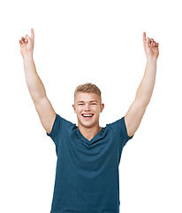 Image showing Happy, portrait and man with hand pointing up to studio for announcement, deal or giveaway on white background. Face, smile and male model show presentation, space or promotion, information or offer