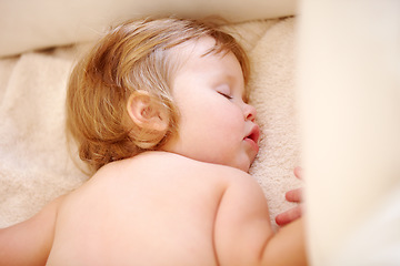 Image showing Closeup, baby and face for sleep on bed from good dream, nap or rest in nursery. Toddler, relaxing or peaceful on pillow, blanket or cozy for child growth, tired or development for future in home