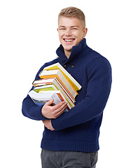 Image showing Happy, books and portrait of man in a studio with positive, good and confident attitude for studying. Smile, pride and young university student with college information isolated by white background.