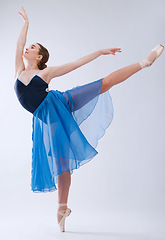 Image showing Ballet, dance and woman with creative freedom isolated on a white background in a studio. Art, training and ballerina dancer dancing with elegance, class and beauty in a room with a backdrop