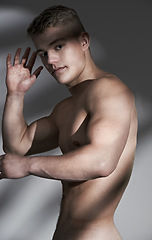 Image showing Man, topless and muscle in studio portrait, hand or wellness for healthy body by white background. Person, shirtless model and exercise for bodybuilder with pride, strong or development for aesthetic