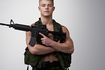 Image showing Soldier man, vest and rifle in studio portrait for military service, fight and fitness by white background. Army agent, government employee and bodybuilder in tactical clothes for battle, war and gun