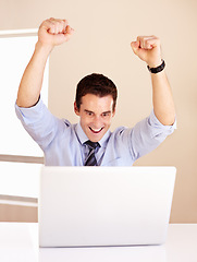 Image showing Business man, winning and laptop with fist, shout and happy for profit, revenue or success on stock market. Investor, trader and winner with pc for financial freedom, goal or cheers with bonus on web