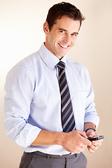 Image showing Phone, portrait or professional happy man typing, texting or message corporate contact, user or search company database. Communication, smartphone or business consultant review networking information