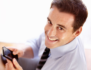 Image showing Business man, smile and portrait with phone, texting and click for email notification, networking and contact. Entrepreneur, smartphone and happy in workplace with communication, social media or app