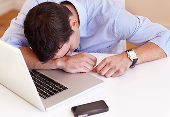 Image showing Business man, sleep and laptop at desk in office with fatigue, frustrated or tired for stress in workplace. Accountant, computer and burnout with smartphone, exhausted or overtime at financial agency