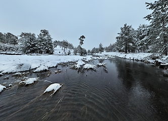 Image showing Amazing Cinematic Aerial View On Freezing River. Aerial View Flight Above Frozen Creek Scenic View Of Nature