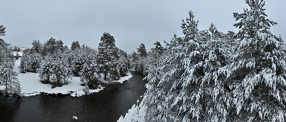 Image showing Amazing Cinematic Aerial View On Freezing River. Aerial View Flight Above Frozen Creek Scenic View Of Nature