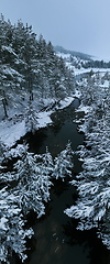 Image showing Amazing Cinematic Aerial View On Freezing River. Aerial View Flight Above Frozen Creek Scenic View Of Nature