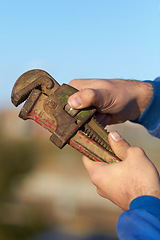 Image showing Hand, mechanic and wrench tool closeup for maintenance or repair, helping or hardware. Man, spanner and engineer for car service job or improvement for fixing at garage, steel workshop for automobile