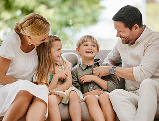 Image showing Family, tickle and play on sofa, laughing and bonding at home, fun and silly humor or comedy. Parents and children, connection and security in relationship, happy and care on couch, love and goofy