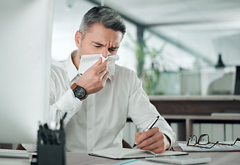 Image showing Business man blowing nose at desk in office for allergies, cold and sick virus while writing in notebook. Mature entrepreneur with tissue for infection, influenza or allergy risk while planning notes