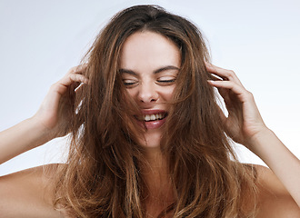 Image showing Hair care, woman or face and smile in studio with hands, collagen treatment or shampoo for waves. Person, happy and cosmetics with dermatology, keratin or beauty with white background for wellness