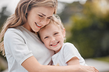 Image showing Nature, hugging and portrait of child with mother in an outdoor garden bonding together. Happy, smile and girl kid embracing her young mom from Canada with love and care in the park or field.