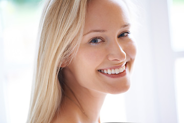 Image showing Portrait, happy woman and smile for skincare in home with closeup for dermatology. Mature person, natural beauty and cosmetics for anti aging, vitamin c and hydration for skin, health and wellness