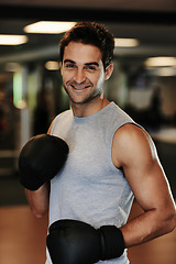 Image showing Man, boxing gloves and training with gym portrait with smile, wellness or exercise for fight, performance or sport. MMA, boxer and happy for contest, competition or workout for development with sweat
