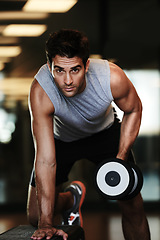 Image showing Portrait, dumbbells and man with fitness, wellness and healthy with performance, workout and practice. Face, person and guy with gym equipment, muscle and energy with training, sweaty and bodybuilder