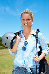 Image showing Woman, parachute and field happy for adventure summer, fearless or outdoor blue skydiving. Female person, smile and portrait or helmet protection for extreme sports or danger, action or jump gear