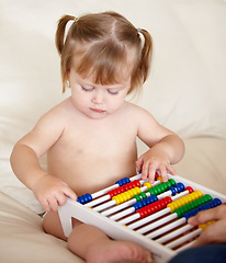 Image showing Learning, child development and a girl baby with an abacus in the bedroom of a home for growth. Kids, education or math with an adorable and curious young toddler counting on a bed in an apartment