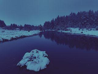 Image showing Amazing Cinematic Aerial View On Freezing River. Aerial View Flight Above Frozen Creek Scenic View Of Nature