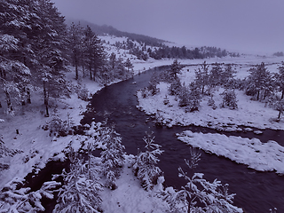 Image showing Amazing Cinematic Aerial View On Freezing River. Aerial View Flight Above Frozen Creek Scenic View Of Nature