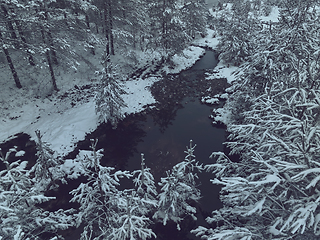 Image showing Amazing Cinematic Aerial View On Freezing River. Aerial View Flight Above Frozen Creek Scenic View Of Nature