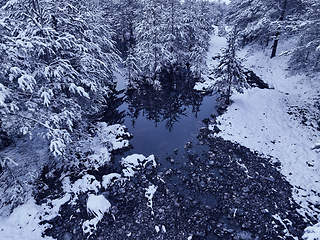 Image showing Amazing Cinematic Aerial View On Freezing River. Aerial View Flight Above Frozen Creek Scenic View Of Nature