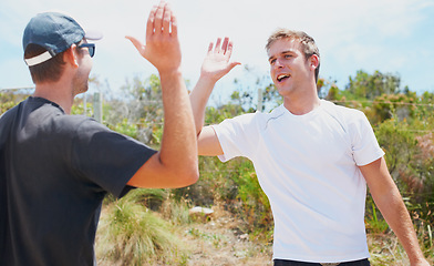 Image showing Sports, high five and fitness in nature with happy, collaboration for training for exercise in summer. Athlete, congratulations and together for outdoor wellness, adventure or teamwork in countryside