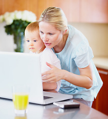 Image showing Woman, baby and laptop for showing in home for learning, playing on streaming online. Mother, little boy or love in bond for growth, development or milestone with skills for technology in kitchen