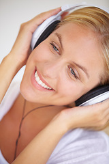 Image showing Happy woman, smile and headphones for listening of music, freedom and wireless for fun in closeup. Female person, face and excitement for technology with podcast, radio or streaming service for relax