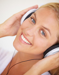 Image showing Portrait, happy woman and headphones for listening to music, freedom and wireless in closeup. Female person, face and smile with excitement for technology with podcast, radio or streaming service