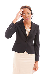 Image showing Business woman, call center and stress or headache for communication mistake or e commerce error in studio. African advisor, consultant or agent thinking of sales fail or worry on a white background