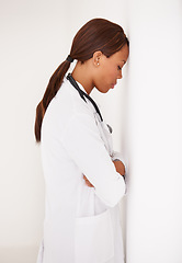 Image showing Tired black woman, doctor and stress in fatigue, burnout or healthcare from mistake at hospital. Face of exhausted African female person, surgeon or medical nurse asleep or leaning on wall at clinic