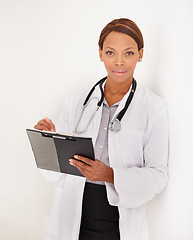 Image showing Doctor portrait, woman and charts or documents for medical information, test results or evaluation in clinic. Face of african healthcare worker writing in folder on a wall or white background