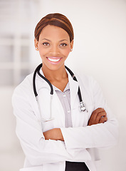 Image showing Doctor, woman portrait and arms crossed for professional career, happy services and confidence in clinic or hospital. Smile of african expert or medical worker with healthcare solution and integrity