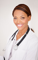 Image showing Happy black woman, portrait and professional doctor smile in healthcare expert against a studio background. Face of African female person, surgeon or medical consultant in clinic, health and wellness