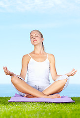 Image showing Woman, yoga and meditation in park for peace, calm and mental health or wellness and mindfulness. Young and zen person relax with outdoor lotus pose, spiritual care and chakra on blue sky background