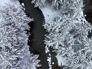 Image showing Amazing Cinematic Aerial View On Freezing River. Aerial View Flight Above Frozen Creek Scenic View Of Nature