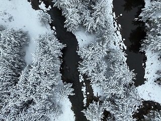 Image showing Amazing Cinematic Aerial View On Freezing River. Aerial View Flight Above Frozen Creek Scenic View Of Nature