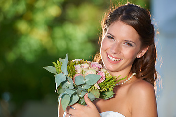 Image showing Woman, portrait and wedding rose bouquet with love, commitment and trust ceremony for marriage. Happy, celebration and flowers for event in a park with a floral plant and bride dress outdoor