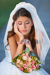 Image showing Nervous, bride and wedding woman with ring outside with confused, bored and grumpy face. Bouquet of flowers, moody and young person in luxury, elegant and white bridal gown for marriage ceremony.