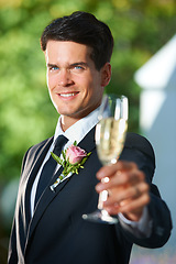 Image showing Wedding, cheers and groom with portrait of champagne for romantic celebration, party or event. Toast, alcohol and young man in suit with sparkling wine at luxury, elegant and fancy marriage ceremony.