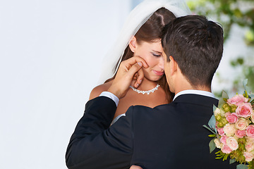 Image showing Wedding, couple hug and woman smile with bride, happy and bouquet outdoor with suit and formal event. Love, commitment and ceremony with celebration, union and bridal dress with roses and loyalty