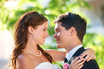 Image showing Happy couple, wedding and hug for love, marriage or affection together in outdoor nature. Married man and woman or newlyweds hugging, smile or support for romantic honeymoon, embrace or commitment