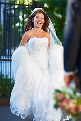 Image showing Excited, bride with smile and running outside to groom with flowers, love and marriage celebration. Happiness, commitment and woman in wedding dress with partner, bouquet and romance at reception.