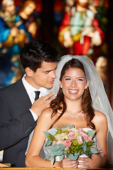 Image showing Happy couple, wedding and flowers at church for marriage, love or commitment together at ceremony. Married man and woman smile with bouquet of roses and bridal dress for relationship or celebration