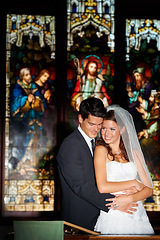 Image showing Happy couple, hug and wedding at church for marriage, love or vow in commitment together. Married man or groom hugging woman or bride with smile for embrace, loyalty or support in trust at ceremony