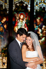 Image showing Happy couple, hug and wedding in church for marriage love or vow in commitment together. Married man or groom hugging woman or bride with smile for embrace, loyalty or support in trust at ceremony